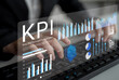 © InfiniteFlow - A business professional is analyzing key performance indicator data displayed on a transparent digital interface. Graphs and charts show insights for effective performance measurement. Gantry
