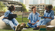 © DC Studio - Medical students collaborating around laptop and case study notes