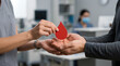 © Golden Eagle - Healthcare workers exchanging blood donation symbols in a medical facility emphasizing community support and health initiatives