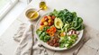 © Dara - A vibrant salad sits on a light-colored stone table. The salad features a base of dark green kale, complemented by sliced cucumbers, cherry tomatoes, avocado slices, and fresh basil leaves.