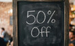 © velikiyzayats - Chalkboard sign with 50 percent off text for retail sales marketing promotion and discounts