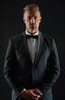 © be free - Tuxedo man in menswear isolated on black. Successful man in formal menswear. Menswear fashion. Elegant tuxedo bowtie. Rich businessman on formal event. Man in rich bespoke tux. Adult life