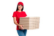 © deagreez - Photo of young happy smiling cheerful service girl delivery stack of pizza fast food isolated on grey color background