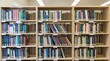 © Muhammad - Wooden bookshelves filled with colorful books in a public library