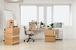 © Pixel-Shot - Corporate downsizing and office relocation, cardboard boxes and packed furniture in an empty workspace during business move or company restructuring