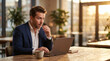 © linno - shocked businessman gasping at laptop screen in warm golden hour light surprised professional reacting to internet news commercial