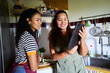 © Alvaro Lavin/Stocksy - Women sharing a digital tablet for cooking recipe