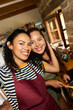 © Alvaro Lavin/Stocksy - Two happy women cooking together in kitchen