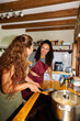 © Alvaro Lavin/Stocksy - Women cooking healthy food in kitchen together