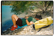 © Eloisa Ramos/Stocksy - Resting Beside Mountain Lake