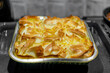© k_samurkas - Freshly baked homemade cheese borek in a metal tray straight from the oven for a warm meal. Achma