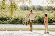 © BGStock72 - Joyful moments by the lake with family on a sunny day