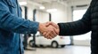 © Panuwat - Professional handshake between a car mechanic and a client in an auto service workshop.