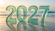 © Abul - 2027 year numbers made of translucent green glass standing on a sandy beach at sunset