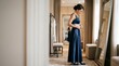 © SashaMagic - Woman adjusting an elegant navy blue evening gown while standing before a large mirror in a boutique fitting room to check the fit and style for a formal event