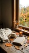 © Welaine - Cozy autumn scene featuring a warm cup of coffee, an open book, and a knitted sweater on a wooden table, adorned with fallen leaves and acorns, all by a window overlooking a colorful fall landscape.