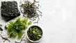 © MdAtiqur - Fresh seaweed salad ingredients with greens and herbs on neutral