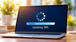 © Kakang - Modern laptop computer on a wooden desk in a bright office or home workspace showing a system software update progress bar at 98 percent with a loading icon and sunny background.