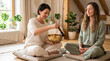 © Angavlan - Traditional healing singing bowl therapy with woman playing bronze bowl, other meditating in light room. This effective traditional healing singing bowl therapy promotes deep peace.