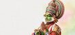 © ckybe - A Kathakali dancer poses with hands folded in front of a gentle pastel background, symbolizing Onam festival warmth.