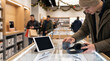 © val_webart - Man shopping for electronics on Black Friday in a modern retail store