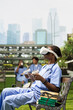© DC Studio - Medical student, VR headset and controllers as a learner explores technology while wearing scrubs. Simulation, innovation and healthcare training suggest interactive study outdoors on campus.