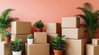 © miss irine - Stack of brown cardboard boxes in new apartment with green houseplants. Cardboard containers for moving home shipping goods. Potted plants decorate space near empty parcels. Concept of relocation,