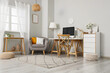 © Pixel-Shot - Remote work and home office setup, modern workspace with computer desk and comfortable armchair in a bright living room interior for freelance lifestyle