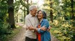 © Mey - An elderly couple embraces warmly in a lush forest setting. The man, with gray hair and a light beige shirt, holds his wife close.