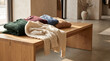 © HiMEL - Folded knitted sweaters on wooden table for winter fashion retail