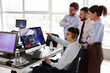 © Pixel-Shot - Financial market analysis and stock trading team, diverse professionals collaborating on investment strategy with data charts on computer monitors