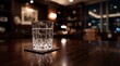 © Yuliyanti - Crystal glass of water on a wooden table in a luxurious dimly lit study at night