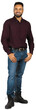 © fotofabrika - Man standing in a studio wearing a maroon shirt and blue jeans
