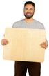 © fotofabrika - Man holds a wooden board and smiles with a neutral background in a bright setting