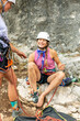 © prelevicm - Girls climbing a rock face together while supporting women empowerment outdoors