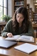 © Image Tree - Woman reading a large book at a library table