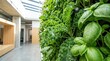 © True Stock - Lush green living wall with various plants indoors