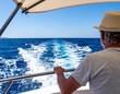 © VexoraImages - Senior man enjoying ocean travel on a boat