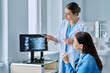 © Valerii Honcharuk - Trichologist examining patient hair with trichoscope in clinic shot