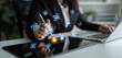 © InfiniteFlow - Business Professional Using Digital Tablet with AI Technology Icons for Innovative Solutions and Data Management in Modern Office Environment. Bitwise.