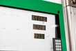 © glebchik - Gas station housing in green color close-up