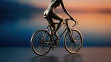 Artistic bronze sculpture of cyclist riding a racing bike.