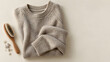 © Nattarika K - Folded knitted sweater with garment brush and removed lint