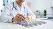 © Paul - Healthcare rating feedback being selected by a doctor on a tablet device.