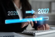 © InfiniteFlow - Progression from 2026 to 2027: Conceptual Image of Future Planning and Time Management with Holographic Interface and Business Environment. Liminal.