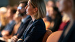 © Laura - Faceless participants attending a professional conference in a hall, with copy space
