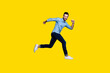 © deagreez - Full length body size view portrait of his he nice cool perfect strong content cheerful cheery macho guy running activity marathon isolated over gray violet purple pastel background