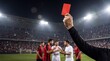 © Curioso.Photography - Football referee holding up a red card during a match in a packed stadium, while players react on the pitch under bright floodlights, illustrating sports discipline, fouls, penalties, and competitive