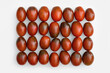 © yrabota - Oval chocolate tomatoes display ordered grid pattern on white background. Plump fresh natural vegetables present deep red color gradient, inspiring healthy cooking farm produce diet, top view