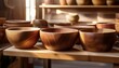 © Abele - handcrafted wooden bowls on display in artisan shop with warm lighting and natural textures